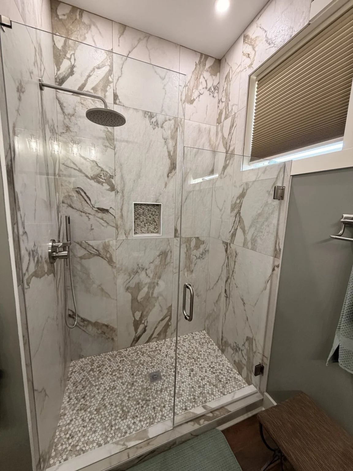 Glass shower and tile details at the Marietta residence